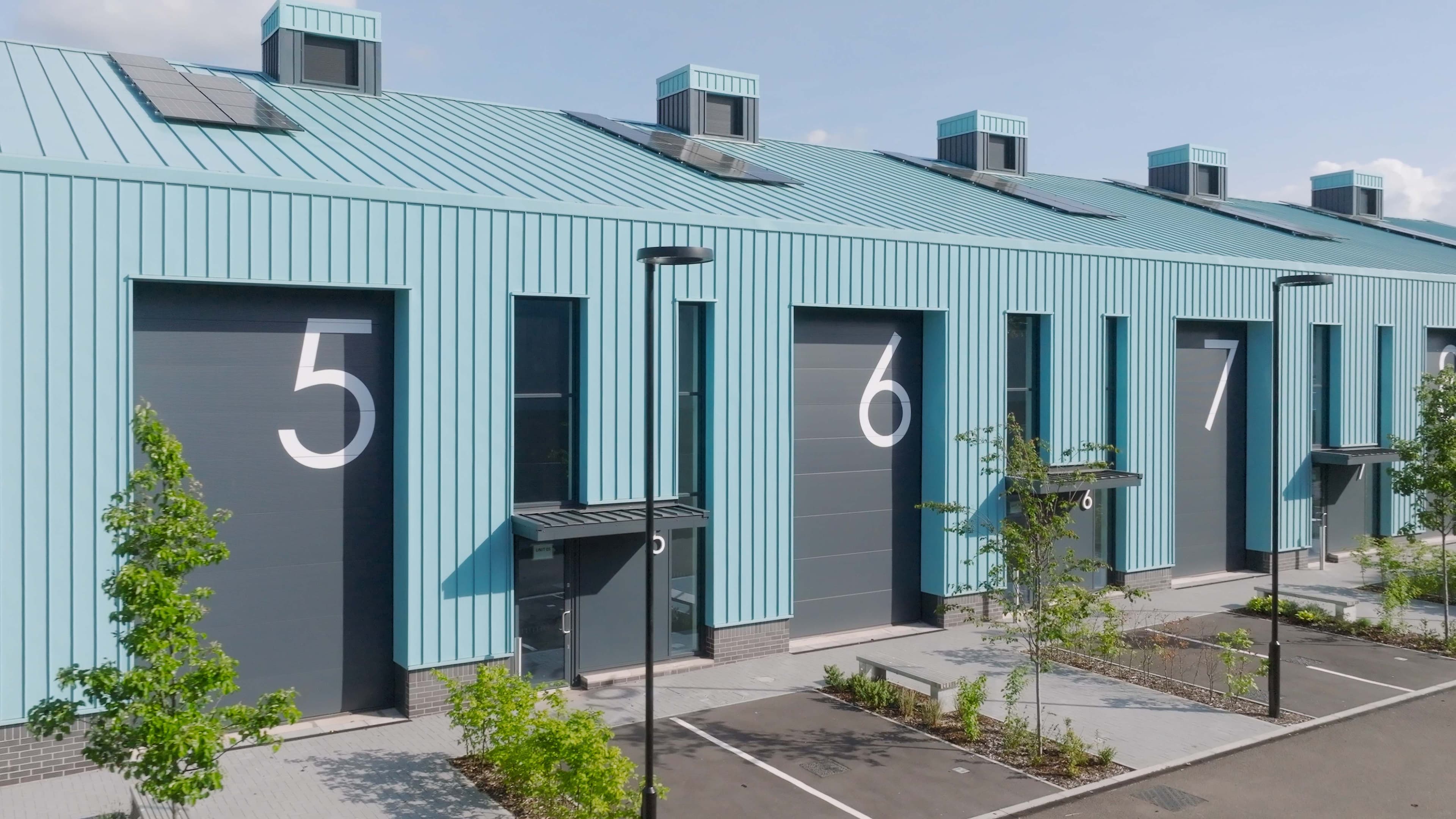 Blue industrial units with Vieo Roof and Wall Systems installed